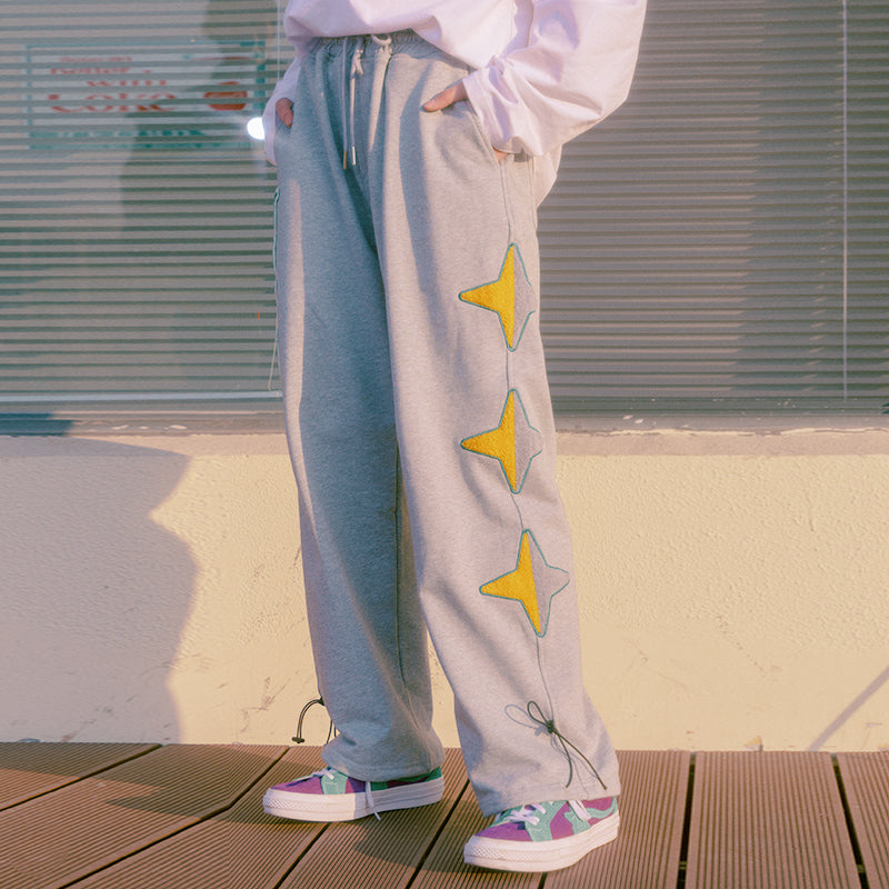 TAKA Original Cosmic Univ. star print sweatpants